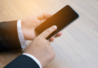 Closeup of hands using smartphone with effect