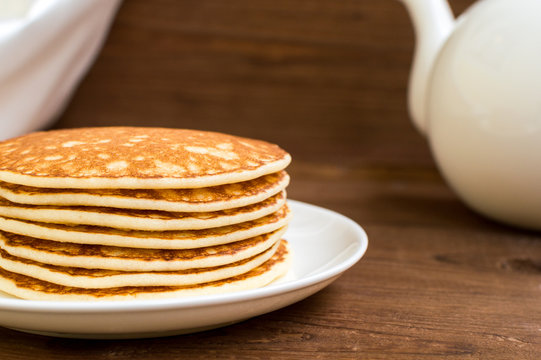 Stack of tasty pancakes on the plate for breakfast
