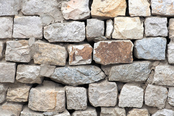 Ancient stone wall built for exterior for background