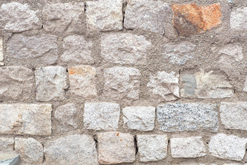 Ancient and dirty sand stone wall built for exterior for background