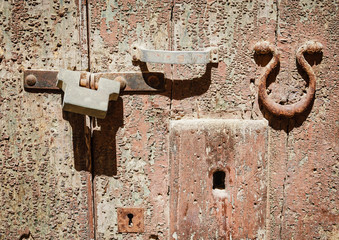 Detail of an old door with handle and lock