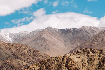Top of rock mountain in blue cloud sky - with copyspace in Leh, Ladakh, India
