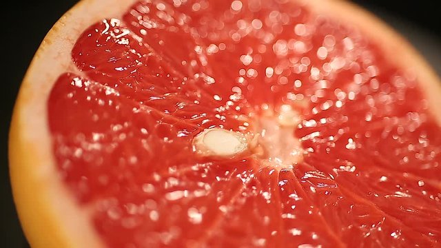 Juicy grapefruit half, appetizing citrus fruit, source of vitamins, healthy diet