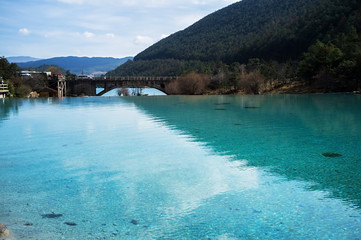 White Water River (Baishui River) with Jade Dragon Snow Mountain background in Blue Moon Valley of Lijiang located at Yunnan, China.