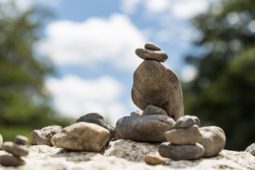 Fototapeta na wymiar Closeup of Zen rock arrangement with nature background