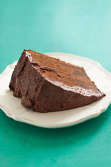 Homemade chocolate cake with cream and dark chocolate, closeup, selective focus