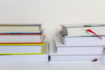 A stack of books on white background. Copy space for your text. Ideas for business and self-development