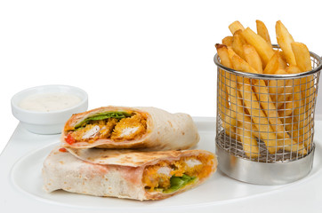 Fast food. Salted pancake with pepper and fried chicken. French fries and a bowl of sauce.