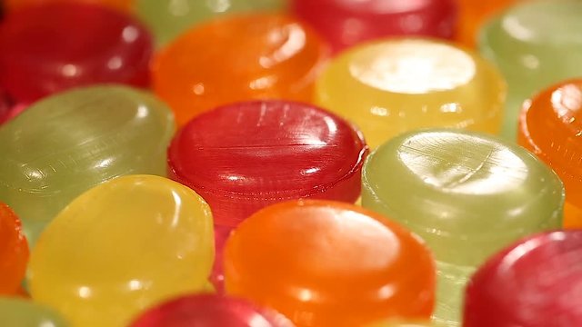 Assortment of colorful hard candies at confectionery shop, variety of sweets