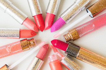 pile of wet coloful lipsticks close up