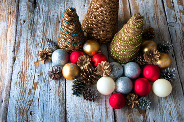 Fototapeta na wymiar Handmade Christmas trees with cones and christmas decorations