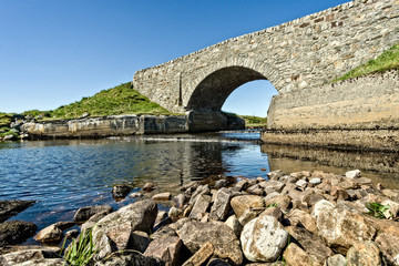 Fototapeta na wymiar Bridge over a small river in Scotland in Europe.