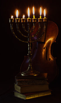 Old Menorah Over Old Books.