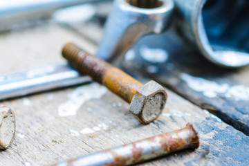 Old, oiled wheel hub lies on a wooden table