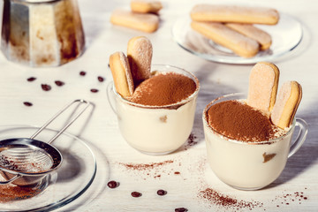 Tiramisu in a glass cup.