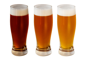 Three glasses of Beer isolated on white background. Lagers, Ales. Oktoberfest.
