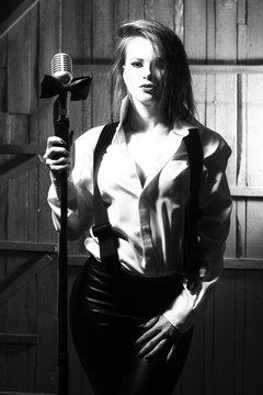 retro woman singing into microphone