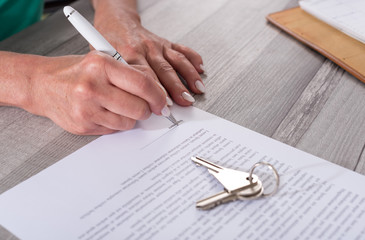 Customer signing a real estate contract
