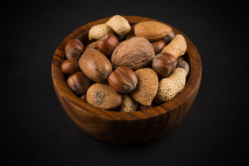 Mixed nuts in shells in a bowl