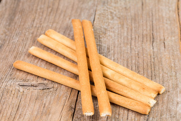 bread sticks grissini on wooden background