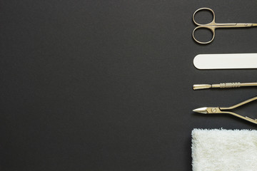 Manicure tools on the dark background