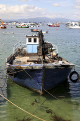 abandoned fishing ship moored in the beach of Arousa island