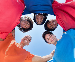 Group of mixed race male young adults in a circle
