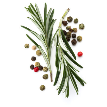 rosemary herb spice leaves and peppercorns isolated on white bac