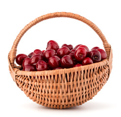cherry berries in wicker basket isolated on white background cut