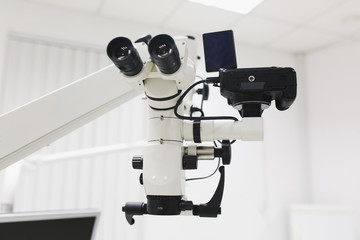 Professional modern microscope equipment at dental office