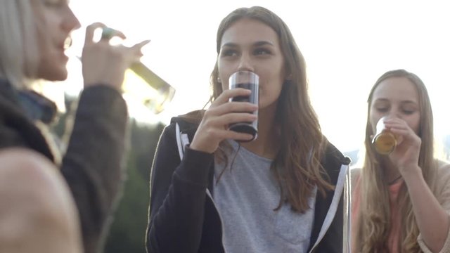 Women drinking beer outdoors