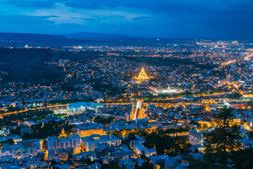 Fototapeta premium Tbilisi Georgia. Aerial Scenic Cityscape View In Evening Illimination,
