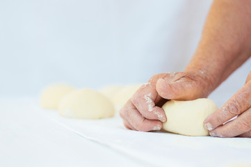 Making dough by grandma's hands.