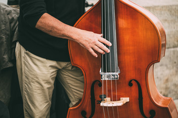 Obraz premium Street Busker Performing Jazz Music Outdoors. Close Up Of Musica