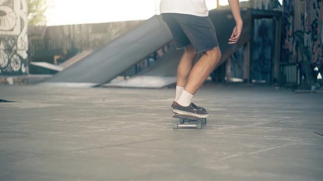 Skateboarder on skate doing jump tricks HD video on skateboard park. Urban extreme sport background
