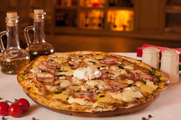 Appetizing pizza with bacon and sauce