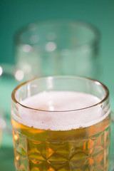 glass of beer with reflection in studio