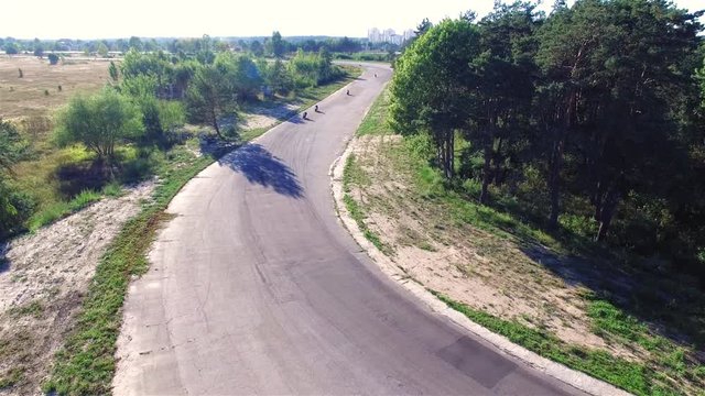 Motorcycle racing 4k aerial video. Moto riders in turn on circuit road track. Extreme sport concept