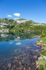 Beautiful alpine lake under a clear blue sky
