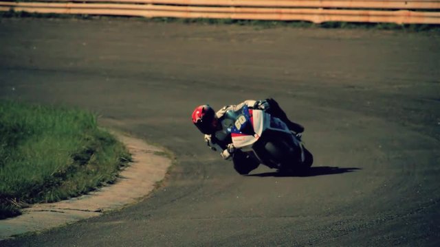 Motorcycle racing HD slow motion static video. Moto rider in turn on circuit road track. Extreme sport concept