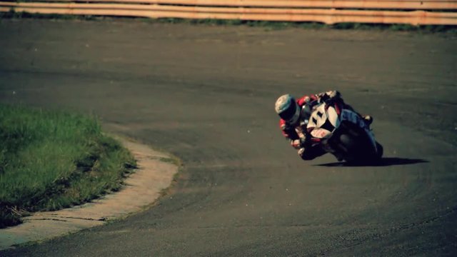 Motorcycle racing HD slow motion static video. Moto rider in turn on circuit road track. Extreme sport concept