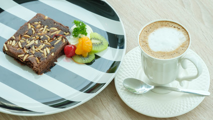 A cup of coffee with brownie