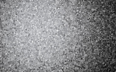 Slice of polystyrene on a gleam. Dark background