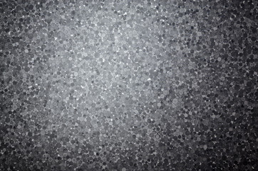 Slice of polystyrene on a gleam. Dark background