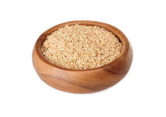 Oatmeal in a wooden bowl on a white background. ingredient for a healthy lifestyle. 