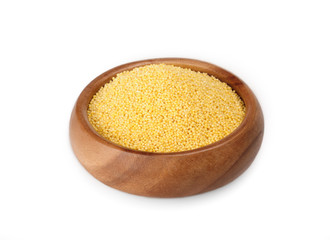 millet groats in a wooden bowl on a white background. ingredient for a healthy lifestyle. 