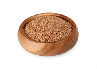 cereal spelled in wooden bowl on a white background. ingredient for a healthy lifestyle. 