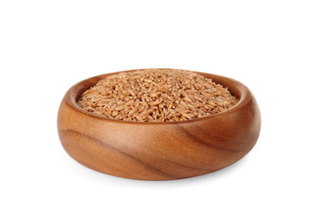 cereal spelled in wooden bowl on a white background. ingredient for a healthy lifestyle. 