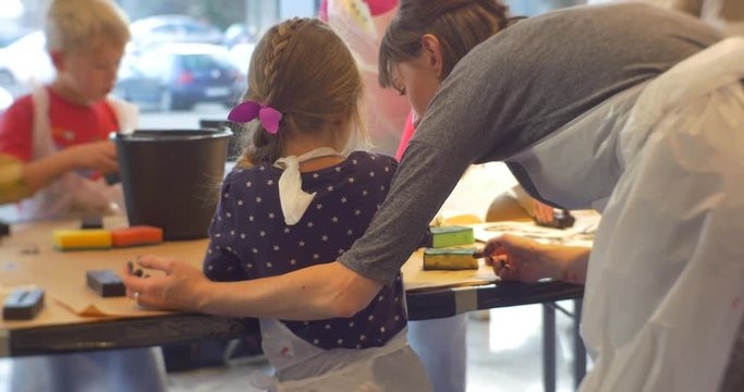 Family Master Class Opole Art Gallery Kids Print a Black Letters Painting in Art Gallery People Put a Stamps in Classroom Educators and Kids Animators