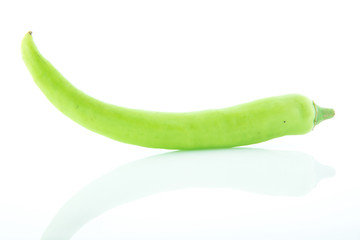 Green chili pepper on white